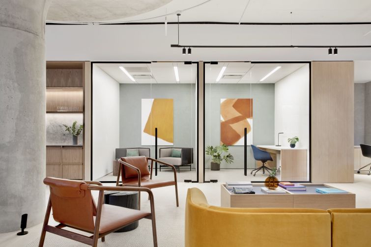 The architects tried to add colorful midcentury modern furniture to offset the more austere industrial look of the building's interiors.