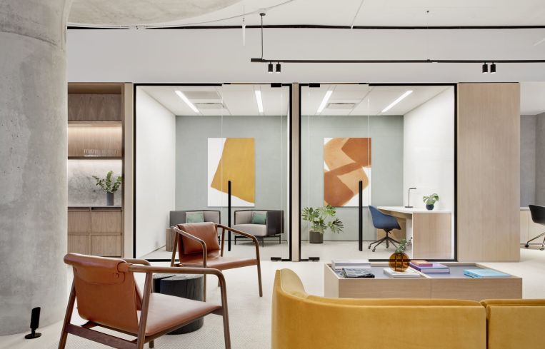 The architects tried to add colorful midcentury modern furniture to offset the more austere industrial look of the building's interiors.