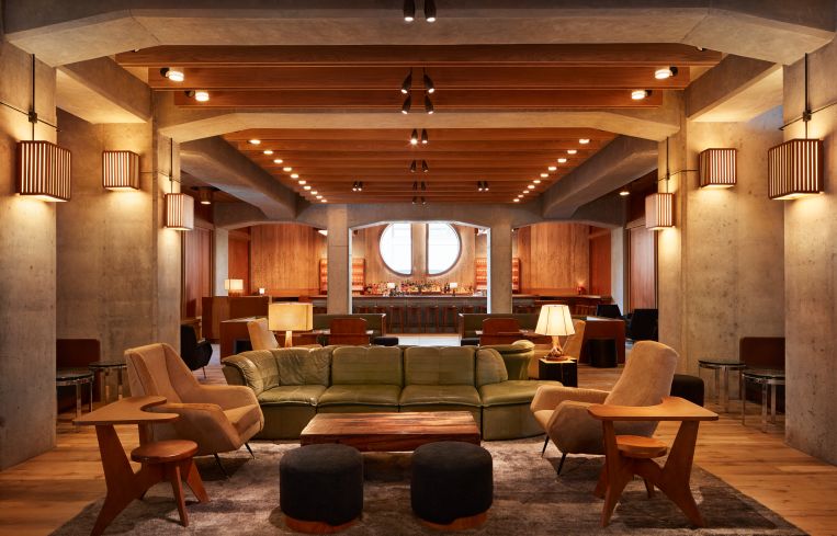 The new ACE Hotel in Downtown Brooklyn has a concrete, somewhat Brutalist exterior with warm, midcentury modern interiors designed by Roman and Williams.