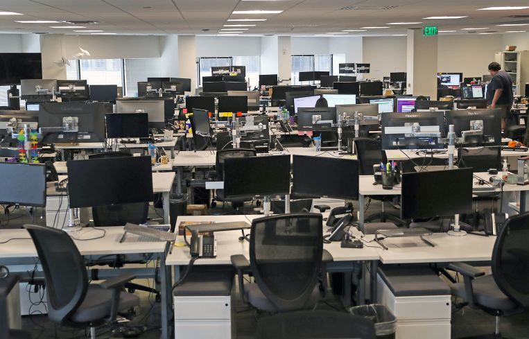 Empty rows of desks.