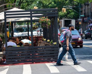 People eat at a cafe during the lunch rush on July 6, 2020 in the Bronx borough of New York City.
