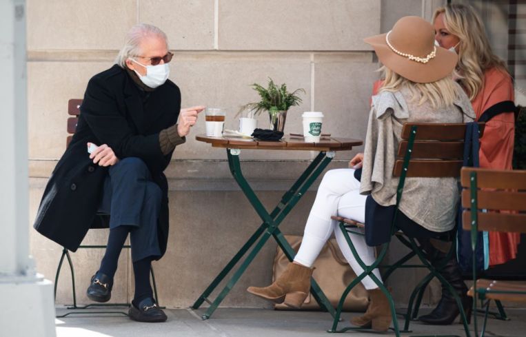 People wear face mask while dining outside a restaurant on the Upper East Side amid the coronavirus pandemic on March 23, 2021 in New York City.