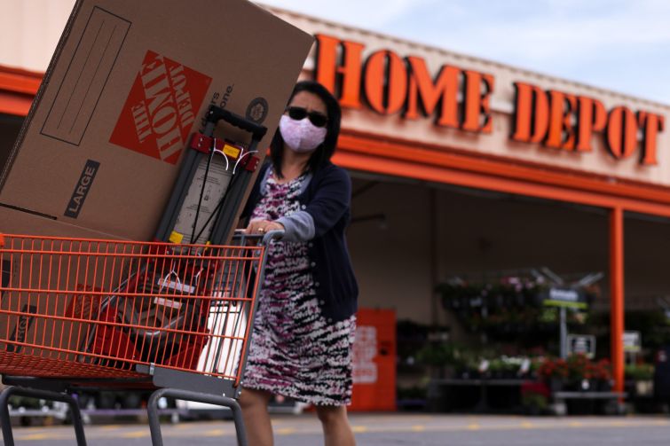A shopper leaves a Home Depot with merchandise last month. Shares of Home Depot dropped more than 4 percent in the second quarter, although profits surpassed analysts expectations.