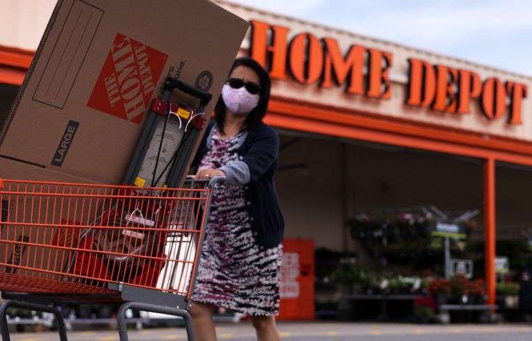 A shopper leaves a Home Depot with merchandise last month. Shares of Home Depot dropped more than 4 percent in the second quarter, although profits surpassed analysts expectations.
