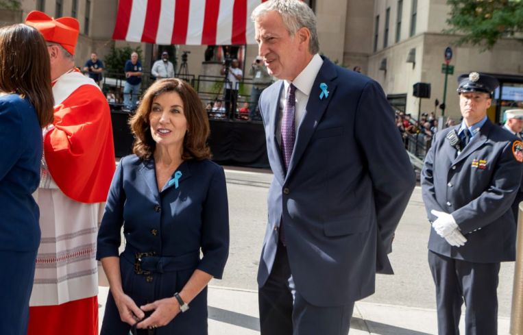 Bill de Blasio stands near New York Governor.