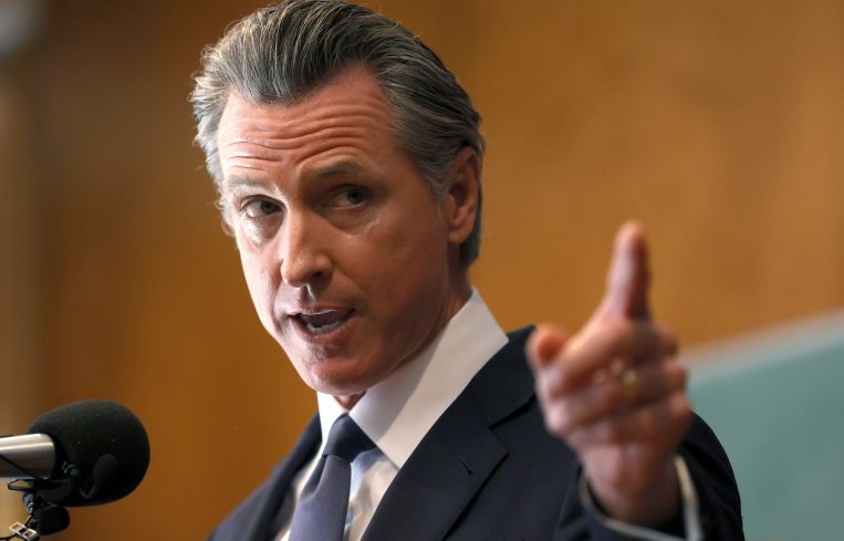 California Gov. Gavin Newsom speaks to union workers and volunteers on election day at the IBEW Local 6 union hall in San Francisco. The attempt to unseat and replace Newsom failed, with more than 64 percent voting to keep him in office.