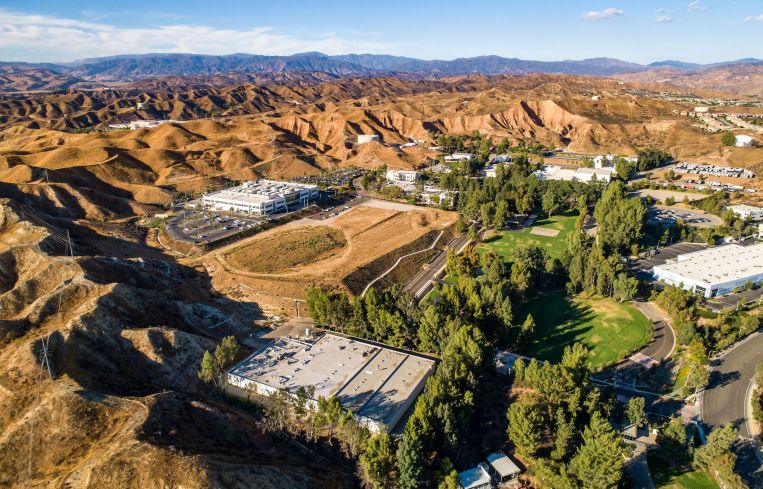 The industrial and life sciences business park spanning 118.5 acres was owned by funds managed by L.A.-based firms Oaktree Capital Management and Intertex Companies.