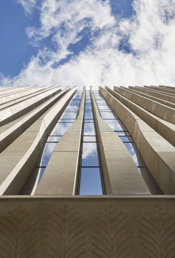 The milled limestone on the facade is meant to resemble a palm leaf.
