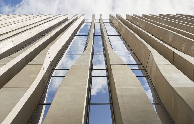 The milled limestone on the facade is meant to resemble a palm leaf.