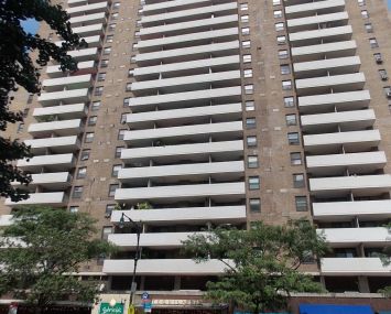 A large grey and white apartment building on the Upper West Side.