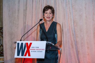 Elise Wagner speaking at the 2021 New York Women Executives in Real Estate Woman of the Year gala.