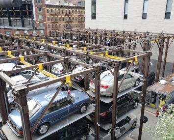 Cars stacked at a mechanical parking deck.