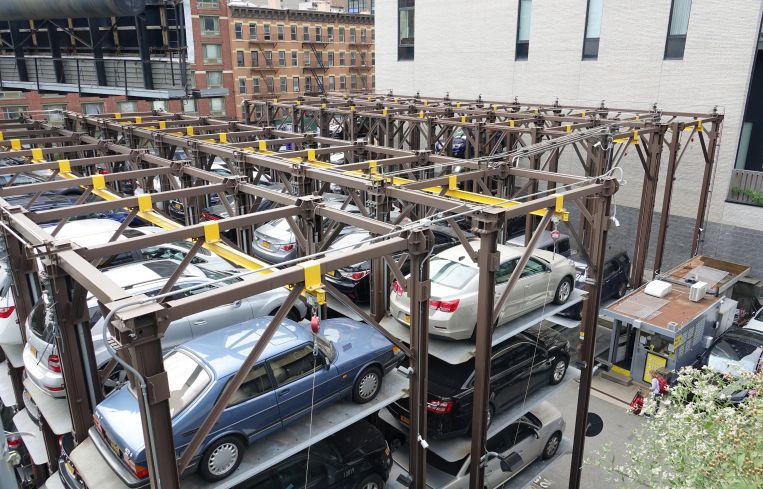 Cars stacked at a mechanical parking deck.