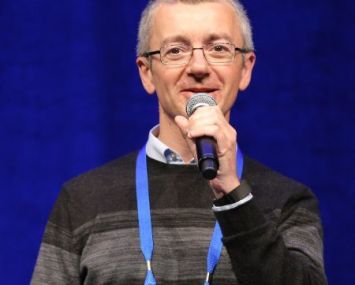 Man holding a microphone.