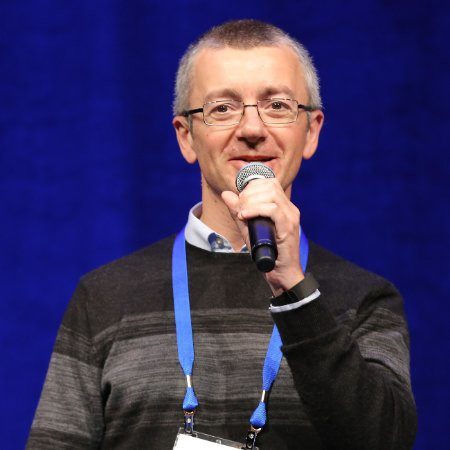 Man holding a microphone.