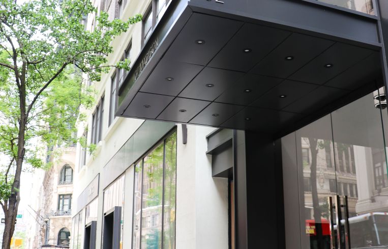 The overhead black awning of 102 Madison Avenue.