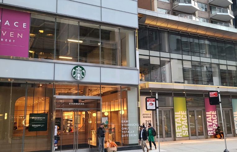 Exterior of the new Starbucks and Amazon combo store at 111 East 59th Street.