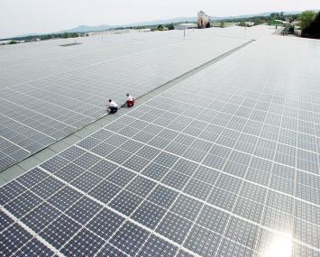 A vast expanse of solar panels on a roof.