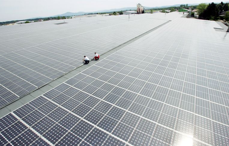 A vast expanse of solar panels on a roof.