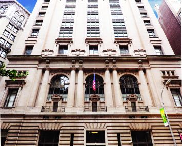 The large tan building at 25 West 39th Street from an angle looking upwards.
