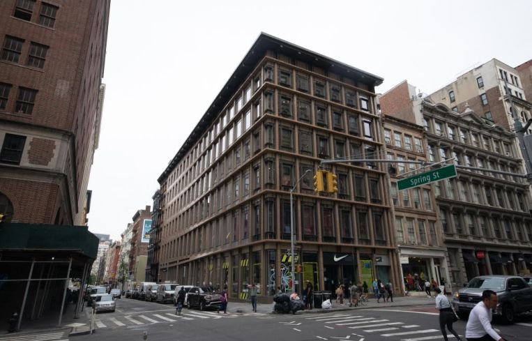 The large brown rectangular building at 529 Broadway, seen from its corner.
