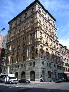 The large white and brown building at 105 Hudson Street.