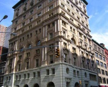 The large white and brown building at 105 Hudson Street.