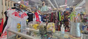 A stall with colorful clothing inside Flatbush Central, the new location for the Caribbean market in Brooklyn.