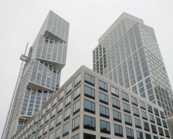 A two-tower luxury building designed by OMA is one piece of the larger Greenpoint Landing development under construction along the Greenpoint waterfront.