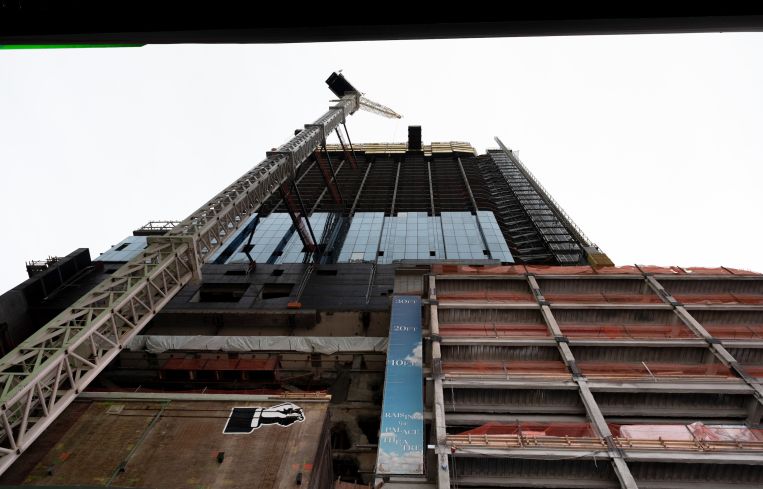The crane and height signage at TSX Broadway construction site where the Palace Theatre is being raised in Times Square in New York City.