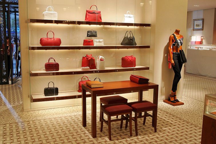 A interior view at the opening of the Hermes store on Wall street on June 21, 2007 in New York City. A wall is decorated with red bags.