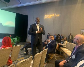 Magic Johnson addresses attendees at Mortgage Bankers Association CREF conference in San Diego.