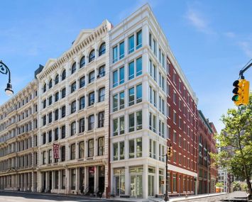 The white corner condo building at 52 Wooster Street.
