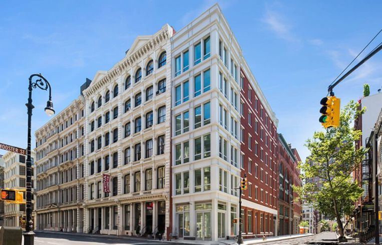 The white corner condo building at 52 Wooster Street.