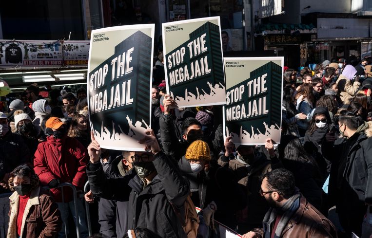 People with protest placards during Lunar New Year parade in
