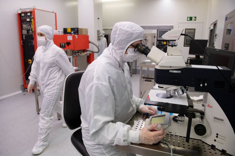 Employees work in a chip manufacturing process institute.