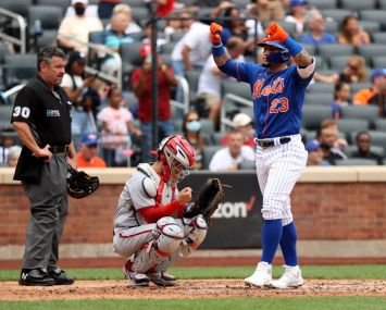 Javier Baez #23 of the New York Mets reacts after hitting a two run home run during the bottom of the fourth inning of a game against the Washington Nationals at Citi Field on Aug. 29, 2021 in New York City.