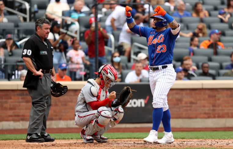Javier Baez #23 of the New York Mets reacts after hitting a two run home run during the bottom of the fourth inning of a game against the Washington Nationals at Citi Field on Aug. 29, 2021 in New York City.