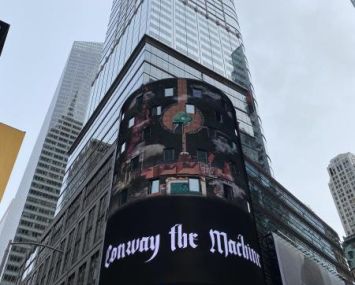 A NASDAQ sign in front of 151 West 42nd Street.