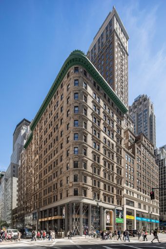 The large tan, two-tiered building at 545 Fifth Avenue.