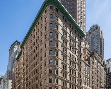 The large tan, two-tiered building at 545 Fifth Avenue.