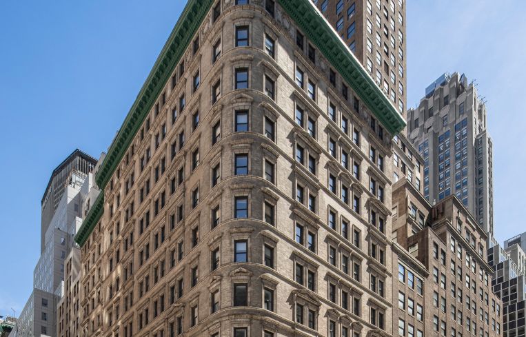 The large tan, two-tiered building at 545 Fifth Avenue.