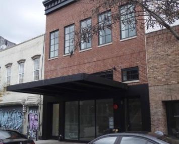 The two-story, renovated red brick building at 109 N Sixth Street.