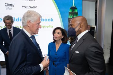 Governor Kathy Hochul, former President Bill Clinton and Mayor Eric Adams at the Empire State Building on April 21, 2022.