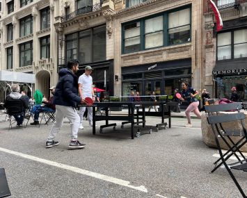 Two people play ping pong in the Flatiron District of Manhattan.