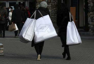CENTRAL VALLEY, NY - NOVEMBER 17:  A person carries bags from Frette at the Woodbury Common Premium Outlets shopping mall on November 17, 2019 in Central Valley, New York. (Photo by Gary Hershorn/Corbis via Getty Images)