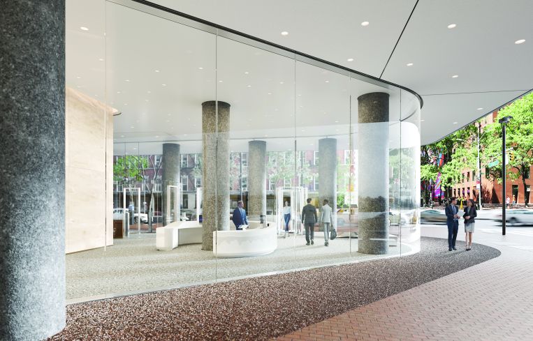 Wooden and glass window panels are being replaced with floor to ceiling glass in the lobby.