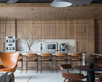 Accordion's new office has a a cafe with plaid wood patterning, which is meant to be a playful reference to men's suits.