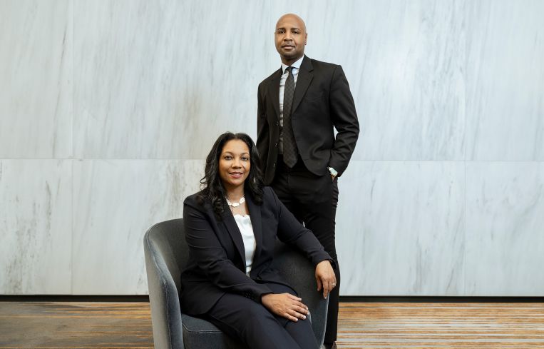 Pamela West (seated, left) and Nadir Settles (standing, right).