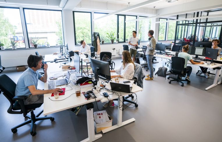 A flex office with people in it.